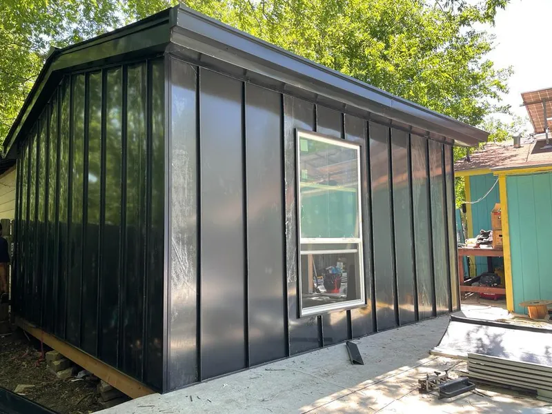 Black standing seam metal wall panels for Roof Inspection in Angier